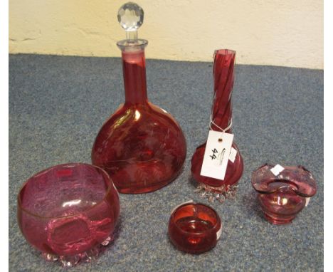 Five items of cranberry glass to include: flask shaped decanter with clear facet stopper; wrythen specimen vase; baluster suc