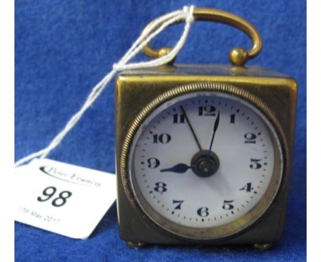 Small early 20th Century cube shaped brass alarm travelling clock with white enamel face and loop handle, having a back windi