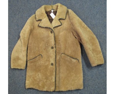 Vintage light brown sheepskin coat with leather piping and plastic wood effect buttons.(B.P. 24% incl. VAT) 