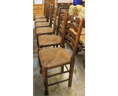 Set of six 20th Century ash and elm ladder back dining chairs with rush seats. (6)(B.P. 24% incl. VAT)