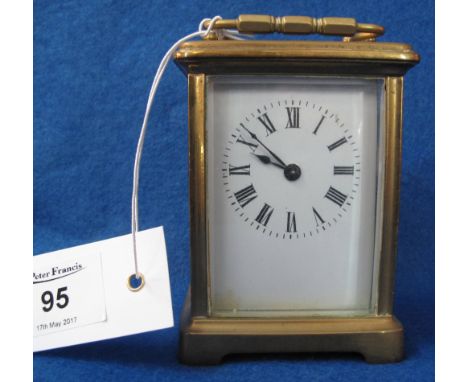 Small early 20th Century brass carriage clock with full depth Roman numeral enamel face and key.(B.P. 24% incl. VAT)   CONDIT