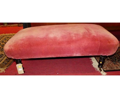 An upholstered long window seat, raised on ring turned supports, w.115cm