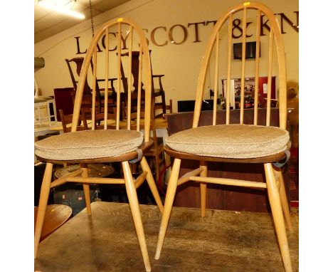 A set of three Ercol light elm stickback dining chairs