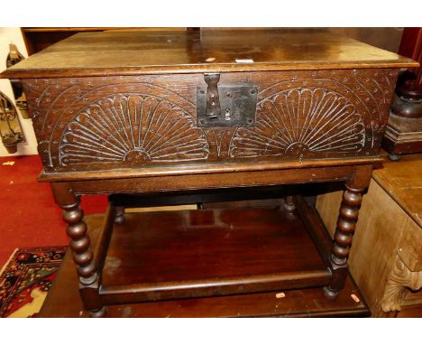 An 18th century line carved oak hinged top bible box, on later bobbin turned fixed stand, width 77cm