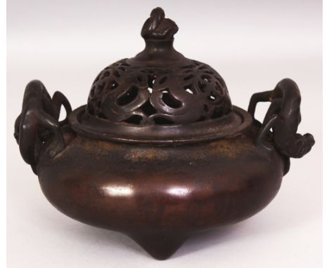 A CHINESE BRONZE CENSER & PIERCED COVER, weighing 1.41Kg, with double chilong handles, the base cast with a two character Xua