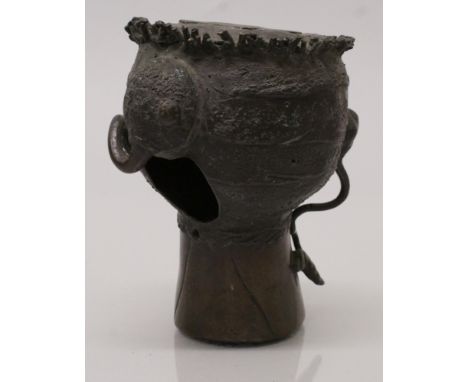 AN UNUSUAL 19TH CENTURY SOUTH-EAST ASIAN BRONZE MODEL OF A LOTUS BUD, the side cast in relief with tendrils, 4.8in high.