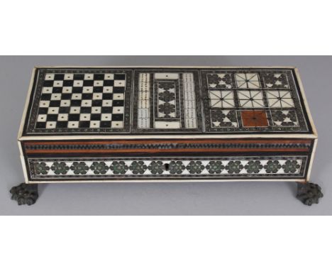 AN INDIAN IVORY & EBONY INLAID SANDALWOOD RECTANGULAR GAMES BOX, with a hinged cover and mosaic decoration, the interior with