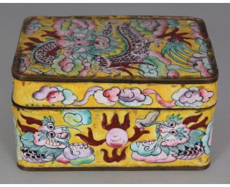 AN EARLY 20TH CENTURY CHINESE YELLOW GROUND CANTON ENAMEL RECTANGULAR DRAGON BOX, with a hinged cover, 4.1in x 3.1in x 2.25in