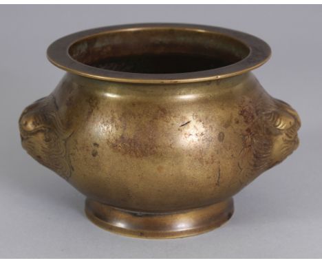 A CHINESE BRONZE CENSER, weighing 800gm, the sides cast with double buddhistic lion handles, 5.5in wide including handles & 4