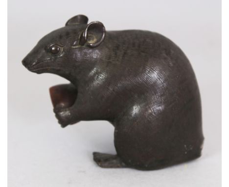 A SIGNED EARLY 20TH CENTURY JAPANESE BRONZE MODEL OF A RAT, the seated animal clutching a coppered nut, the base with an engr