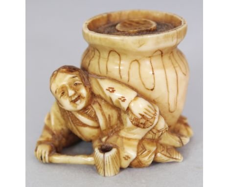 A SMALL JAPANESE MEIJI PERIOD STAINED IVORY OKIMONO, unsigned and possibly intended as a netsuke, carved in the form of a man