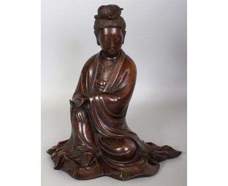 A LARGE GOOD QUALITY 19TH CENTURY CHINESE SILVER-METAL INLAID SHISOU BRONZE FIGURE OF GUANYIN, the Goddess seated with her he