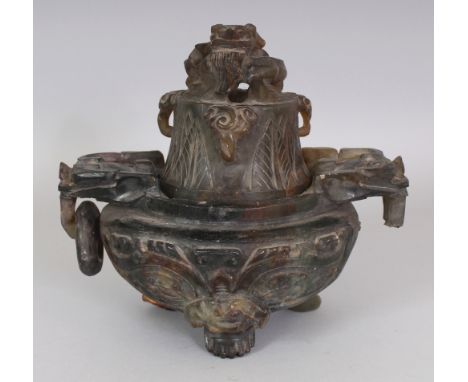 A LARGE 20TH CENTURY CHINESE CARVED HARDSTONE TRIPOD CENSER & COVER, of archaic design, the stone of a dark brown/green hue, 