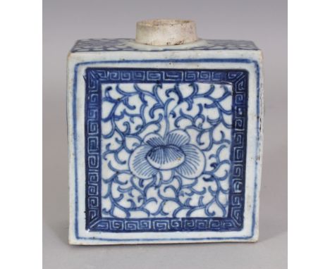 A 19TH CENTURY CHINESE BLUE & WHITE RECTANGULAR PORCELAIN TEA CADDY, the sides painted with stylised scroll-stemmed peony, th