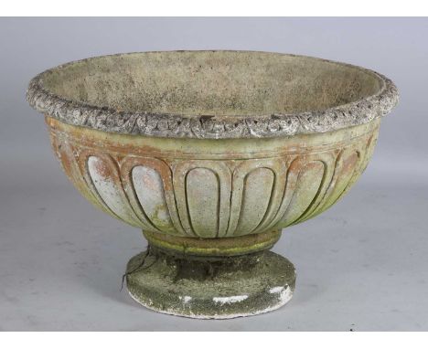 A large 20th century cast composition stone circular garden urn, the exterior with reeded lobes, height 60cm, diameter 100cm.