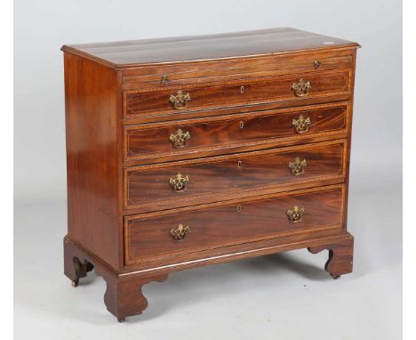 A 19th century mahogany chest with crossbanded borders, fitted with a brushing slide and four long drawers, on bracket feet, 