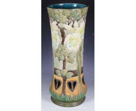 A late 19th century Burmantofts Faience pottery stick stand, model number '2210', the tubelined, incised and pierced body dec