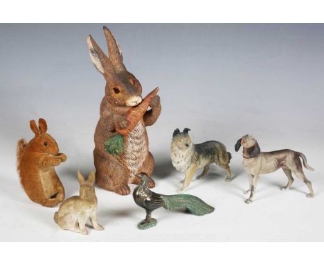 An early 20th century cold painted earthenware novelty inkwell in the form of a rabbit, height 22.5cm, two cold painted cast 