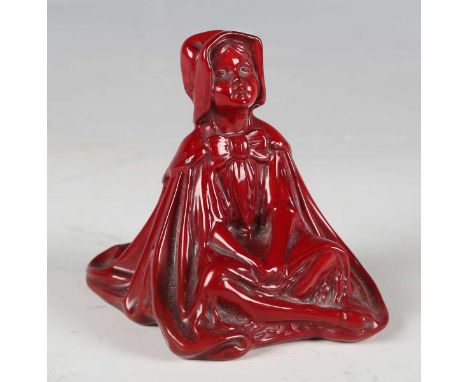 A rare early 20th century Bernard Moore flambé glazed figure of Little Red Riding Hood, modelled seated cross legged, painted