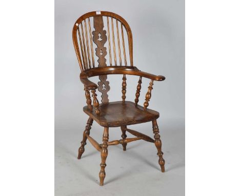A late 19th century ash and elm stick back Windsor armchair with a pierced splat and solid seat, height 115cm, width 66cm.