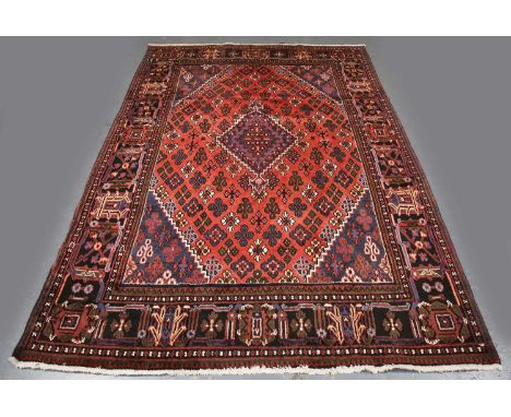 A Joshaghan carpet, North-west Persia, mid-20th century, the pink field with an angular medallion, within a palmette and vine