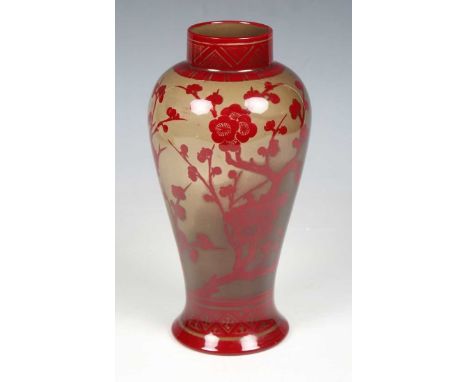 An early 20th century Bernard Moore red flambé glazed vase, the ovoid baluster body decorated with peony against a taupe grou