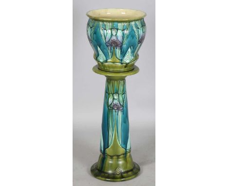 An early 20th century Mintons Secessionist pottery jardinière and matching stand, model number 72, both pieces tubelined and 