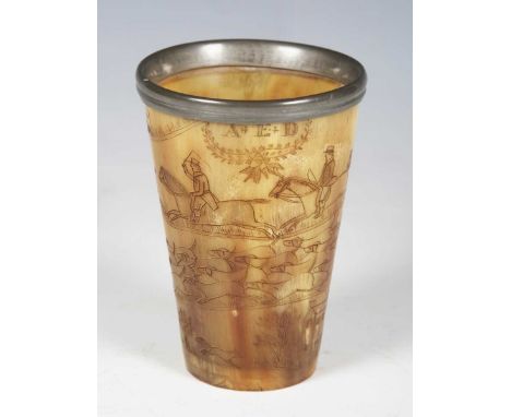 A late 19th century horn beaker with pewter rim and engraved hunting scene, height 12cm.