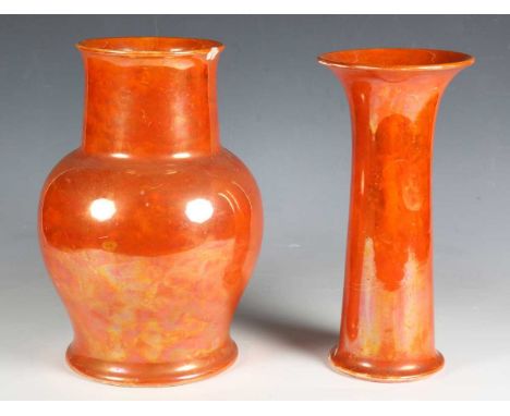 Two Ruskin pottery orange lustre glazed vases, both dated 1920, the first of cylindrical shape with flared rim, height 30cm, 