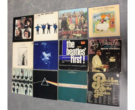 A collection of approximately thirty LP records, including 'Dark Side of the Moon' by Pink Floyd, A-4 B-5 matrices, lacking i