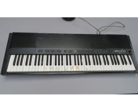 Yamaha vintage PF70 electronic piano circa 1980's made in Japan with user manual. Tested and in working condition with a few 
