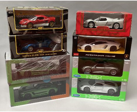 8 assorted 1/18 scale diecast model cars. All boxed.