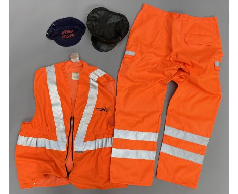 A Great Western Railways Co. cap, an Engine Driver cap and Network Rail fluorescent waistcoat and trousers. (4)