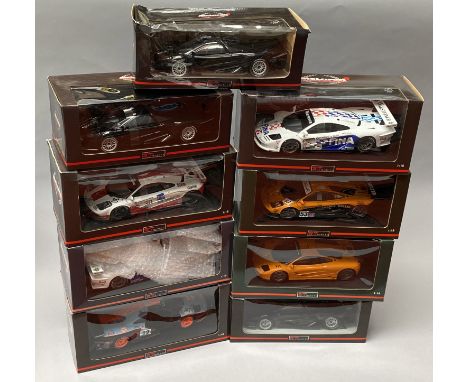 9 UT Models 1/18 scale McLaren diecast model cars. All boxed.