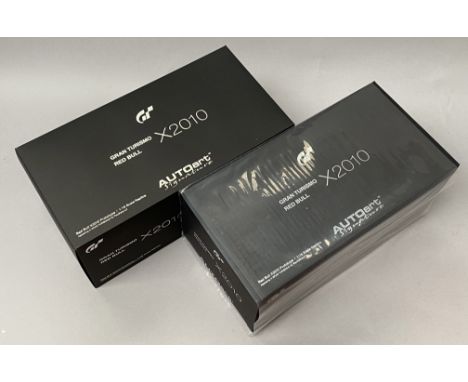 2 AutoArt Signature 1/18 scale Grand Turismo Red Bul X2010 diecast model cars. Both boxed. (2)CONDITION REPORT:  both sealed 