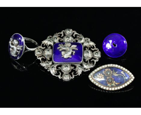 A 19th Century enamel and pearl brooch, of oval shape decorated applied flowers on a blue enamel ground within a border of pe