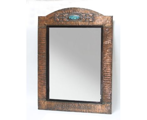 An Art Nouveau copper framed mirror, the arched top with oval blue enamel plaque to the centre and embossed 'An English Maide