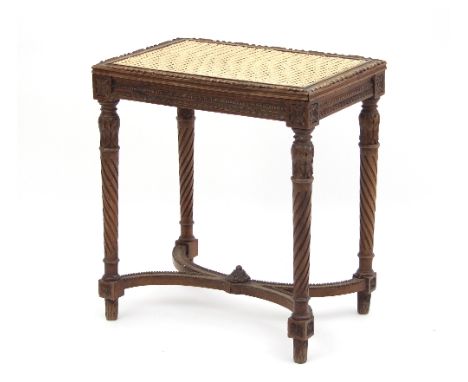 A French cane seat stool, on spirally reeded legs united by an X-shaped stretcher with beaded border, 50cm wide