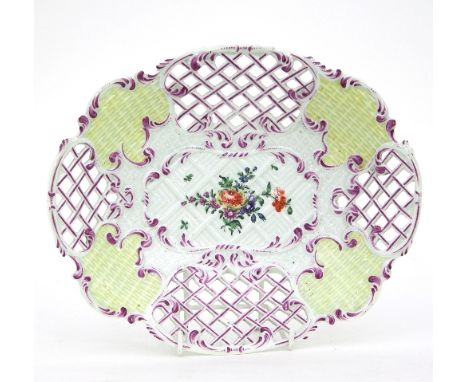 A Worcester yellow-ground moulded and pierced dish, circa 1760, with basket-weave and lattice panels, heightened in puce, a f