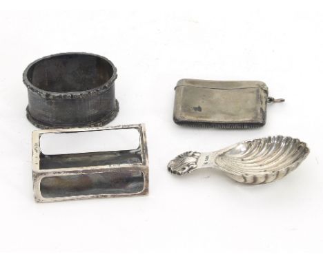 A silver caddy spoon, a silver napkin ring, a silver vesta case and a silver match box holder, approximately 120gm