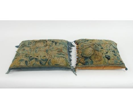 A 17th Century style verdure needlework cushion, 60cm square and a similar smaller cushion