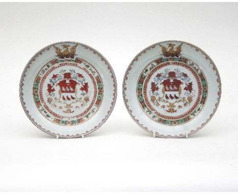 A pair of famille verte and Chinese Imari armorial saucer dishes, Kangxi, 1731, the arms within a famille verte border of flo