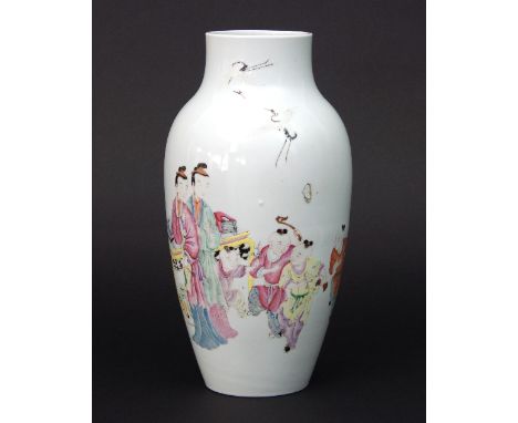 A Chinese famille rose baluster vase, Qianlong seal mark and of the period, enamelled with a scene of two ladies surrounded b