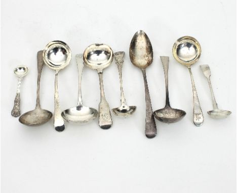 A collection of George III silver sauce ladles (various dates), a silver table spoon, a mustard spoon, a small sauce ladle an