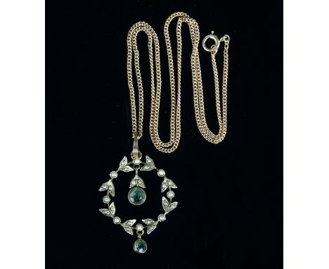 An aquamarine and seed pearl wreath type pendant, centred by an aquamarine drop and with another drop below, on a fine link n