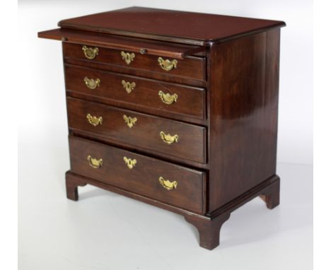 A good quality Irish mahogany Georgian period Chest, of small proportions, the moulded top above a brushing slide with four g