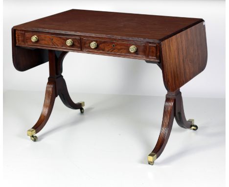 A fine quality Regency mahogany Sofa Table, c. 1820, attributed to Gillows, with reeded edge top incorporating demi-lune drop