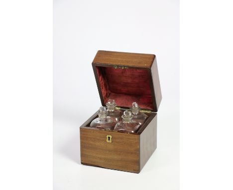 An attractive and fine quality small Georgian period mahogany Decanter Box, with four original bottles and stoppers, and with