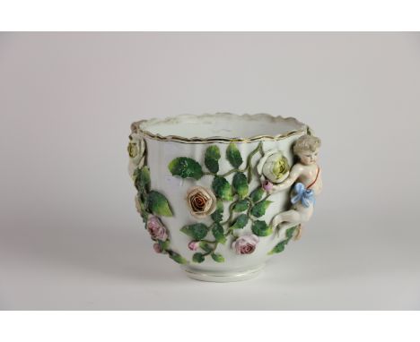 A 19th Century Sitzendorf porcelain flower encrusted Bowl, applied with two cherubs and scrolling foliage, 20cms h x 26cms w 