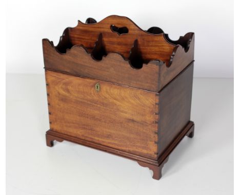 A good Irish Georgian mahogany lift top Cellaret, the compartmented and shaped top with carry handle over a plain container, 